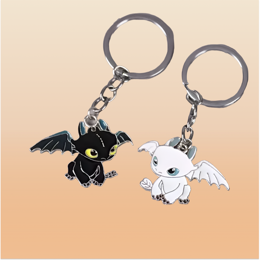 Black & white dragon couple keychain on a neutral background