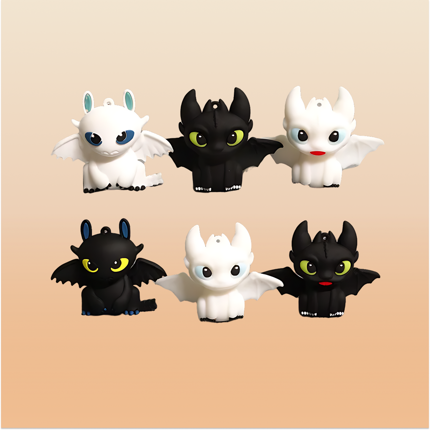 Set of black & white mini dragon figures on a neutral background